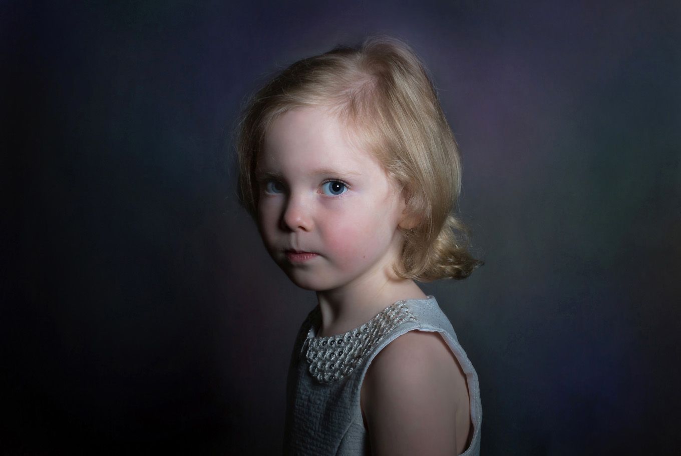 Portrait of a little girl in a studio